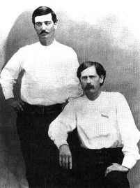Bat Masterson (standing) and Wyatt Earp in 1876, when they were deputies in Dodge City, Kansas.