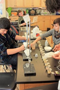 Sean, Jem, Indi, and Jeffrey add water to soil samples