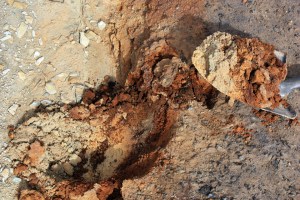 Soil layers showing different types of contamination, in the middle wash downstream from the Swansea mine dump.