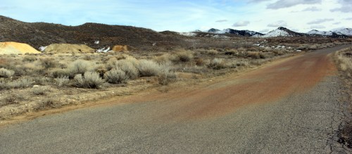 Staining on the asphalt where water draining off of the Swansea mine dump runs over the road near Silver City.