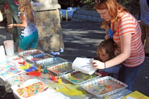 Laying paper onto the oil paint layer.