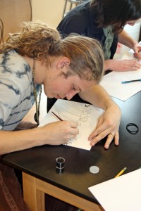 Zach practices daring Elvish calligraphy using homemade ink