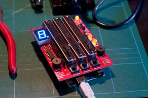 Danger Shield sensor board mounted onto an Arduino controller (underneath). Our setups were similar. Notice the three manual sliders and LED readout. Various types of sensors can be attached.