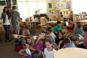 Nicole and Tanner demonstrate how to make ice cream at the elementary school