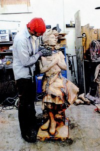 Assembly of the Wingless Victory statue. Large pieces are welded and stapled together, then smoothed and sandblasted to remove seams.