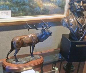 An elk and Mark Twain. Notice the differences in the patina colors on the elk.
