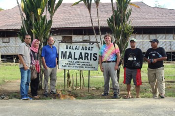 Group with guides by longhouse