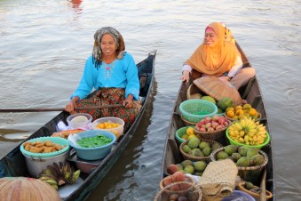 Two ladies in boats