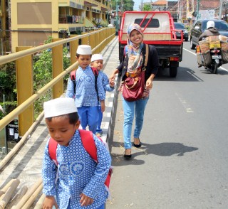 Little boys on bridge