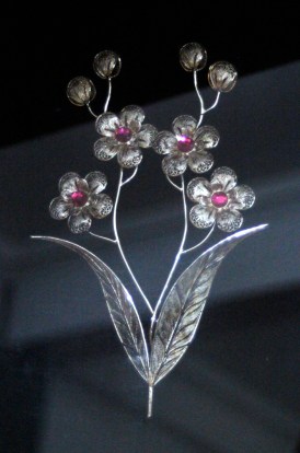 Silver flowers with red centers